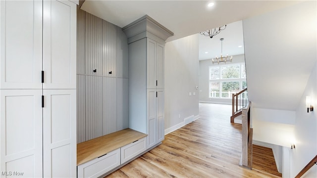 mudroom with light wood finished floors, visible vents, baseboards, an inviting chandelier, and recessed lighting