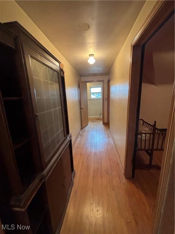 hallway with light wood finished floors