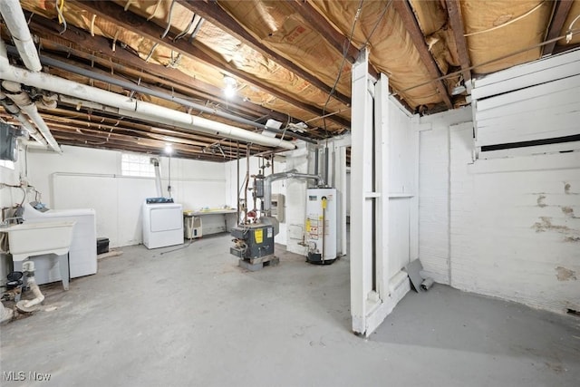 basement featuring water heater and a sink