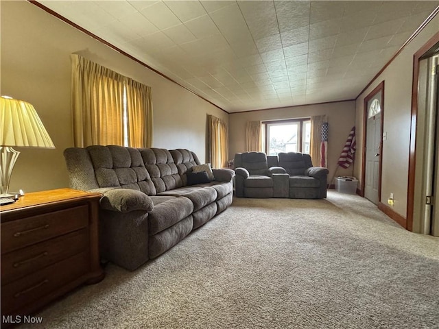 living room featuring crown molding and carpet flooring