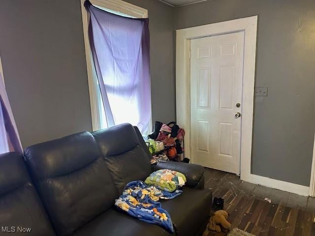 living room with wood finished floors and baseboards