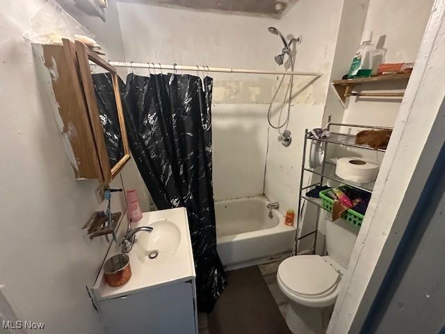 bathroom featuring shower / tub combo, vanity, and toilet