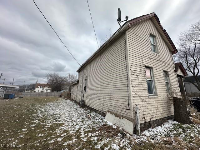 view of home's exterior featuring fence