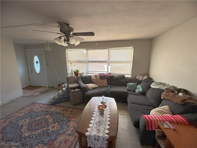 living room featuring a ceiling fan