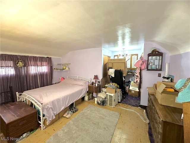 bedroom featuring vaulted ceiling