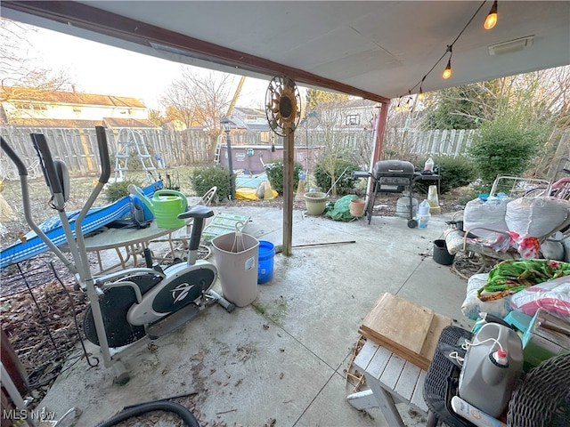 view of patio with a fenced backyard and area for grilling