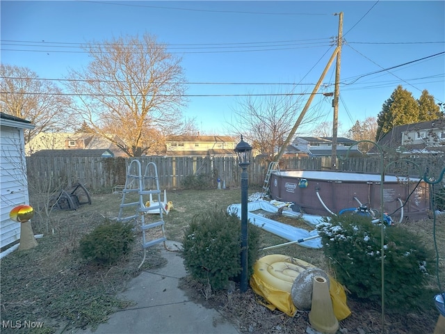 view of yard featuring a fenced backyard and a fenced in pool