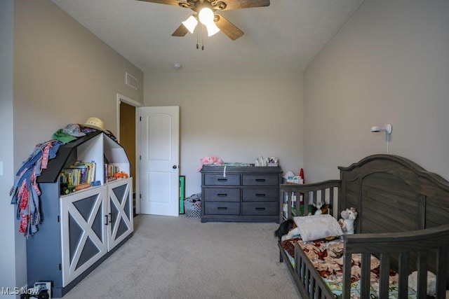 carpeted bedroom featuring visible vents and ceiling fan