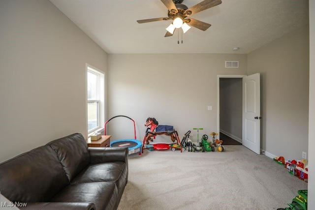 recreation room featuring visible vents, ceiling fan, baseboards, and carpet