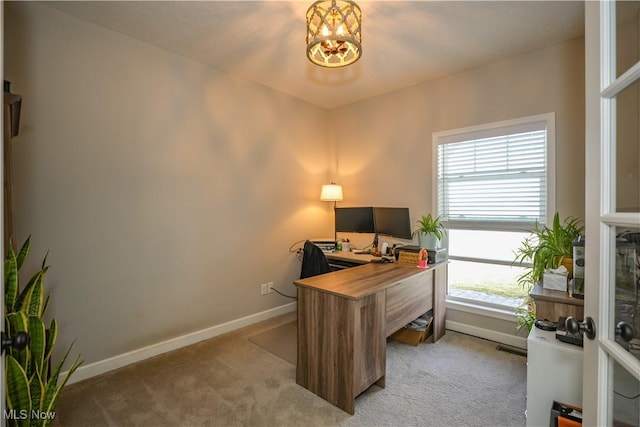 home office with light carpet and baseboards