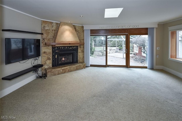 unfurnished living room with recessed lighting, a large fireplace, carpet flooring, baseboards, and ornamental molding