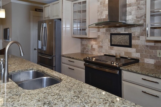 kitchen with electric stove, stainless steel refrigerator with ice dispenser, backsplash, a sink, and wall chimney exhaust hood