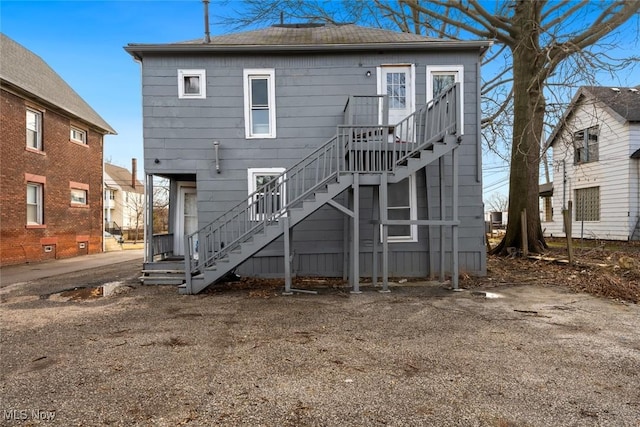 back of property with stairway