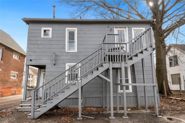 back of house with stairway