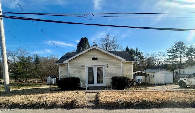 exterior space with an outbuilding and a detached carport