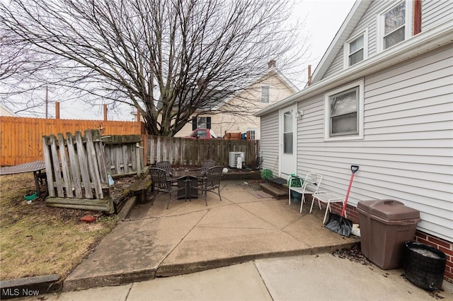 view of patio / terrace with entry steps and fence