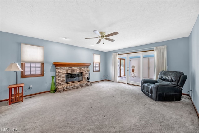 carpeted living room featuring a brick fireplace, baseboards, and visible vents