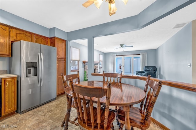 dining area with a ceiling fan and visible vents