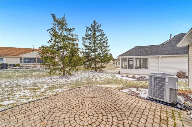 view of yard with a sunroom, a patio area, and cooling unit