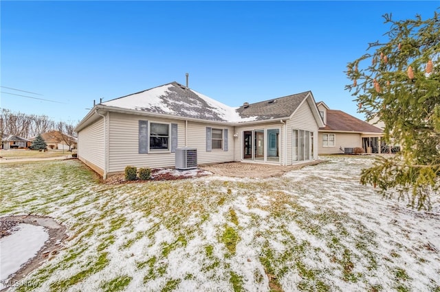 rear view of property featuring cooling unit