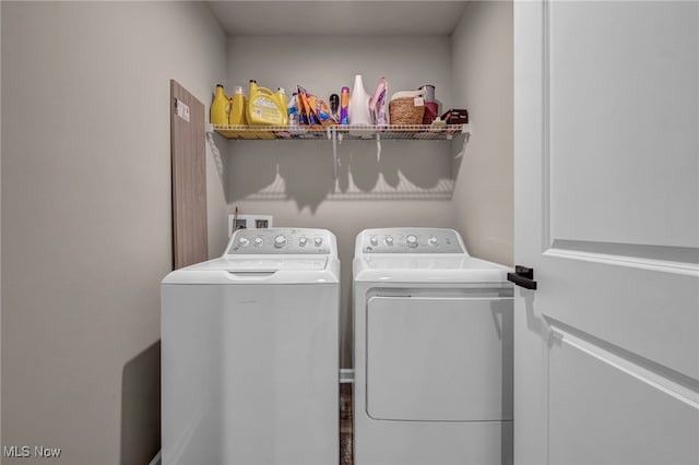 clothes washing area with laundry area and separate washer and dryer