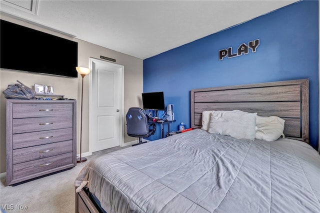 carpeted bedroom featuring baseboards