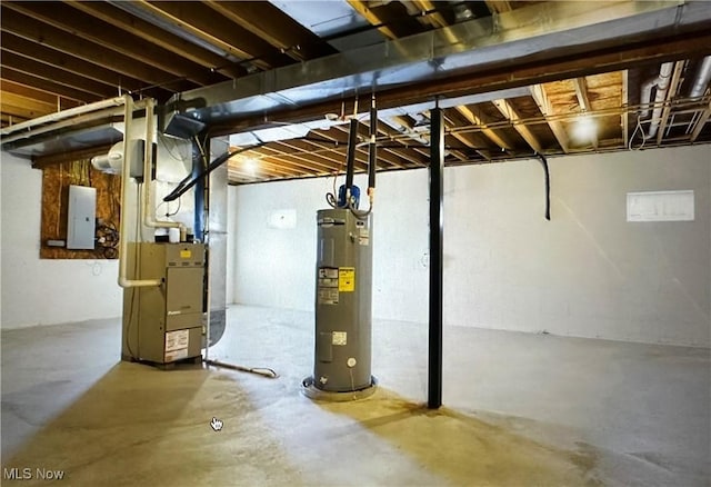 unfinished basement featuring electric panel, heating unit, and water heater