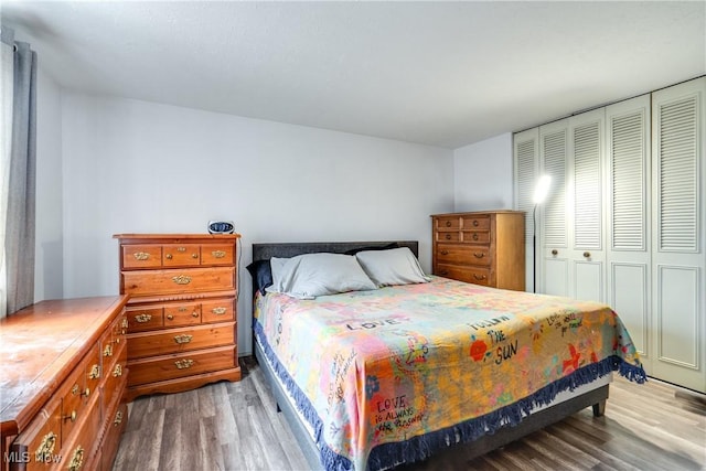 bedroom with a closet and wood finished floors