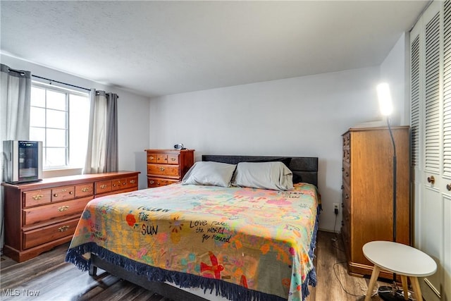 bedroom with wood finished floors