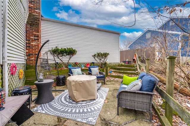 view of patio / terrace featuring fence and an outdoor hangout area