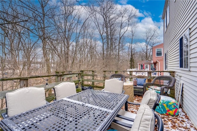 wooden deck with outdoor dining space and outdoor lounge area