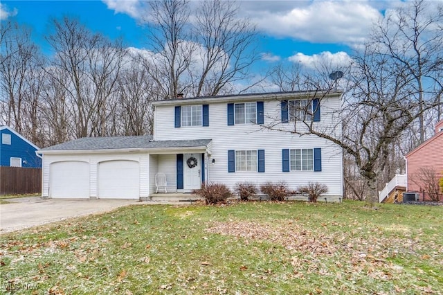 view of front of property with concrete driveway, an attached garage, a front yard, fence, and cooling unit