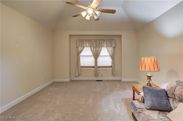 unfurnished room featuring carpet, vaulted ceiling, and baseboards