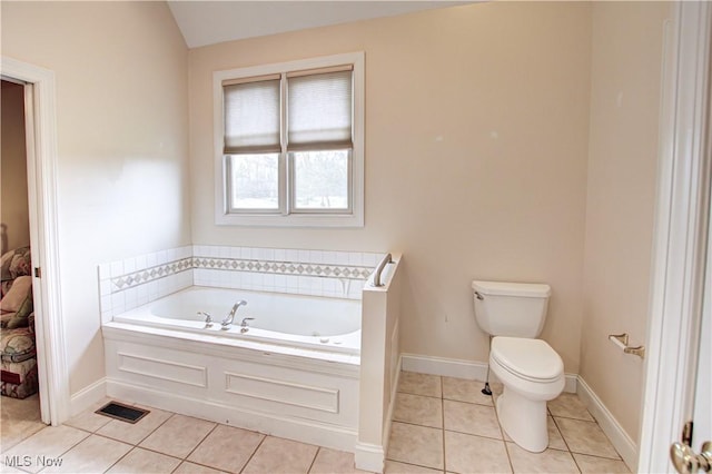 full bath with visible vents, baseboards, toilet, a garden tub, and tile patterned flooring