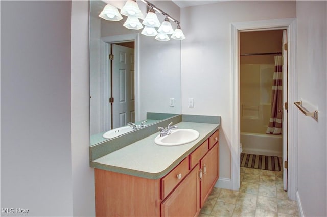 full bathroom featuring vanity and shower / bath combo with shower curtain