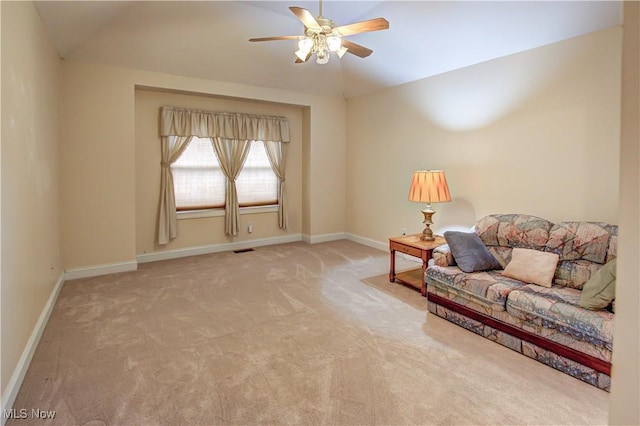 sitting room with a ceiling fan, baseboards, visible vents, and carpet flooring