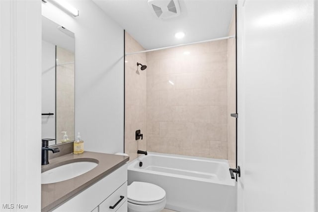 bathroom featuring visible vents, vanity, toilet, and bathing tub / shower combination