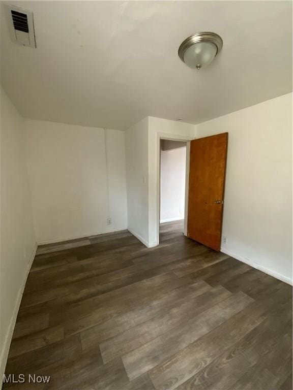 406 Vine St, East Liverpool, OH 43920 - empty room with visible vents, dark wood finished floors, and baseboards