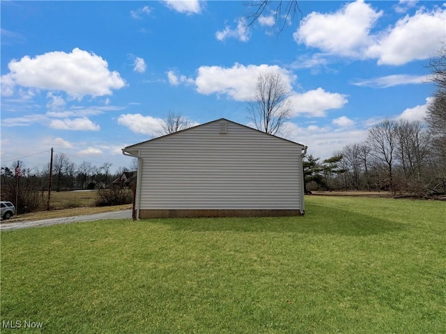 view of home's exterior featuring a lawn