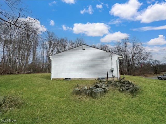 view of side of property with a lawn