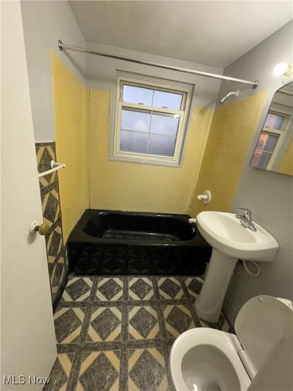 bathroom with toilet and walk in shower