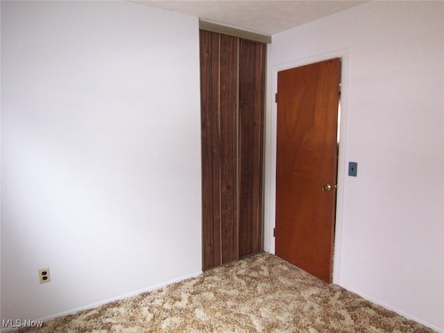 spare room with carpet floors