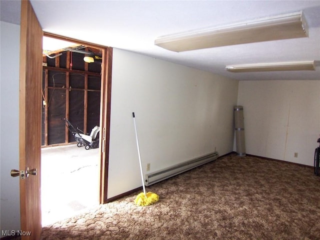 below grade area with carpet and a baseboard radiator