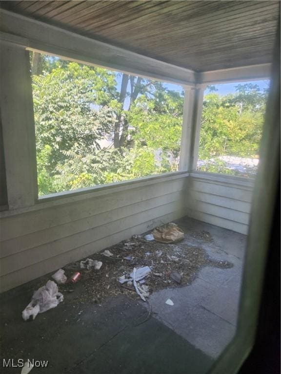 unfurnished sunroom featuring a wealth of natural light