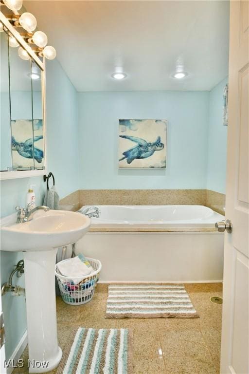 bathroom with a garden tub