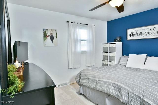 bedroom featuring ceiling fan, carpet, and visible vents