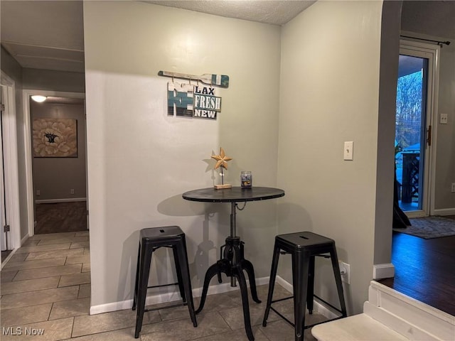 5192 University Dr, Geneva, OH 44041 - dining area with a textured ceiling and baseboards
