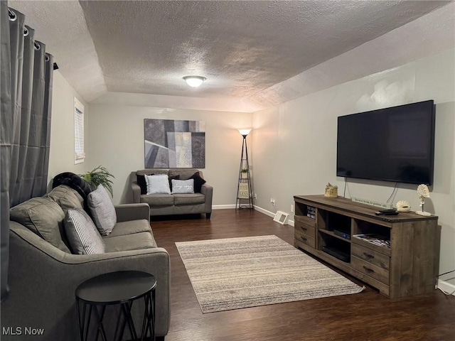 5192 University Dr, Geneva, OH 44041 - living room featuring baseboards, visible vents, and wood finished floors