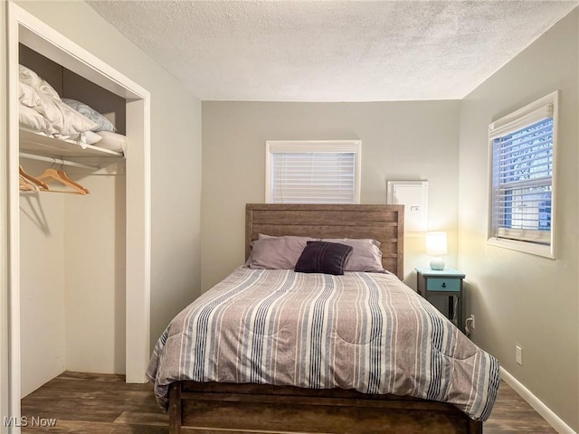 5192 University Dr, Geneva, OH 44041 - bedroom with a textured ceiling, baseboards, and wood finished floors