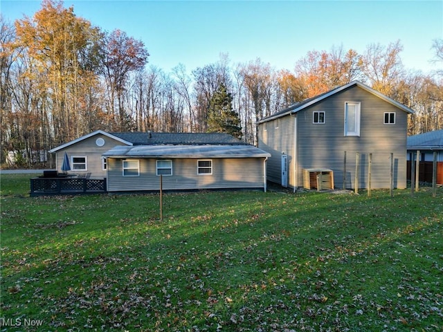 5192 University Dr, Geneva, OH 44041 - rear view of house featuring a lawn